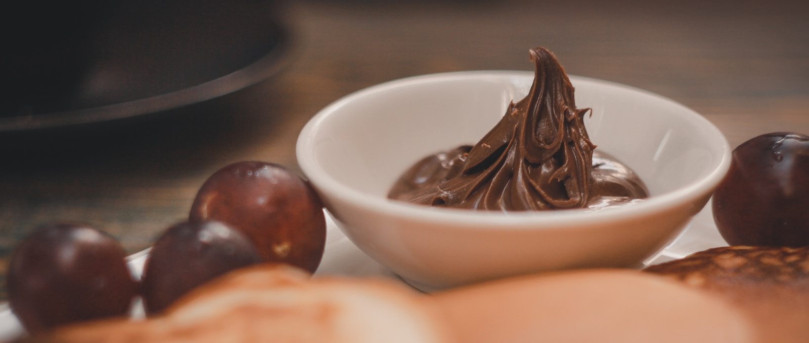 brown and white chocolate on white ceramic bowl
